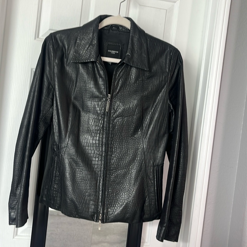 Woman’s 100% black leather jacket, size small.